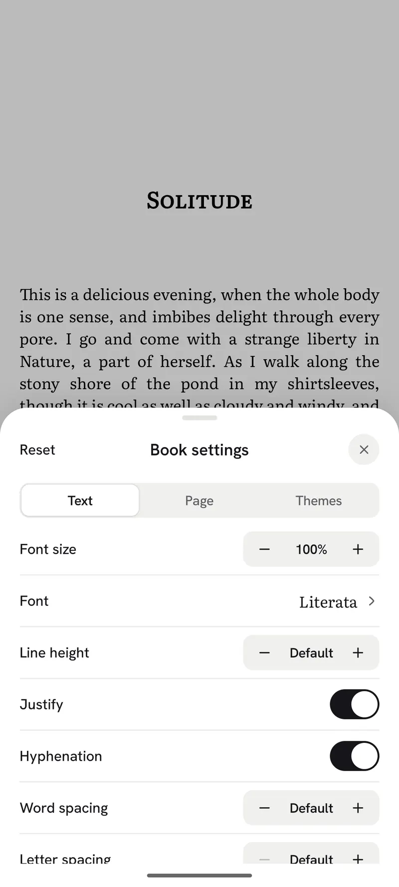Reader settings open over a book